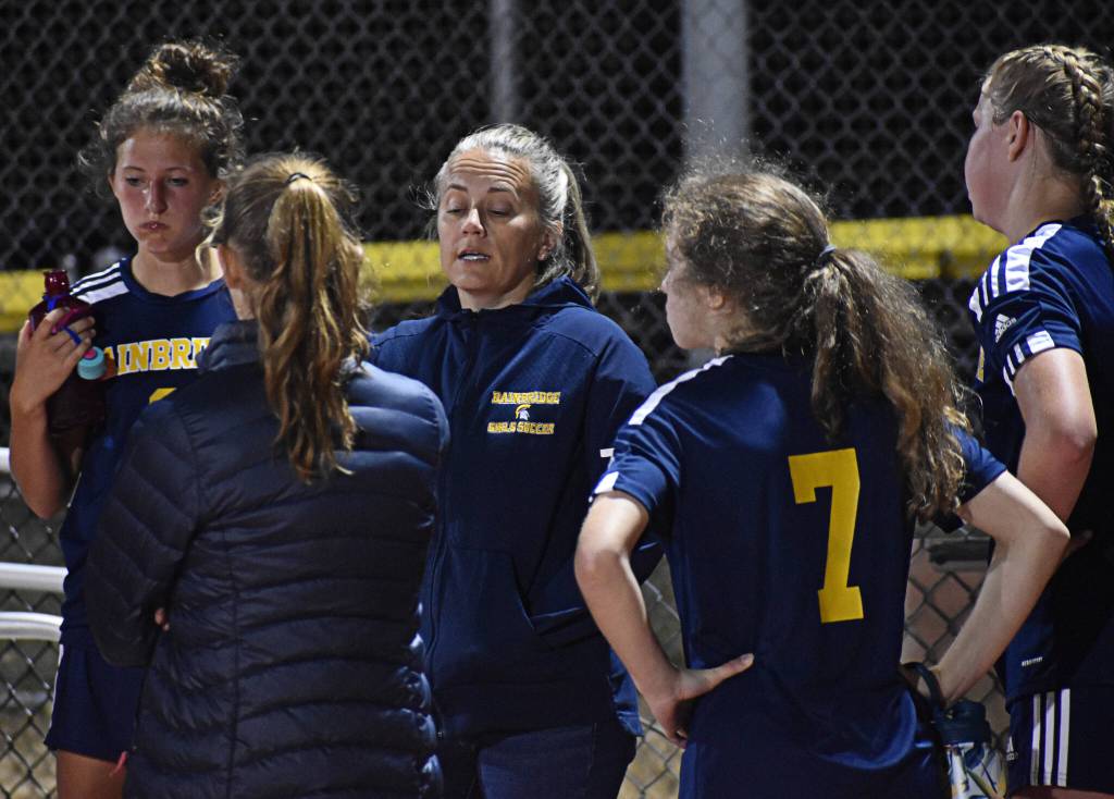 Bainbridge coach Katie Dorvahl speaks to her team about how this game is just a learning step for the rest of the season.