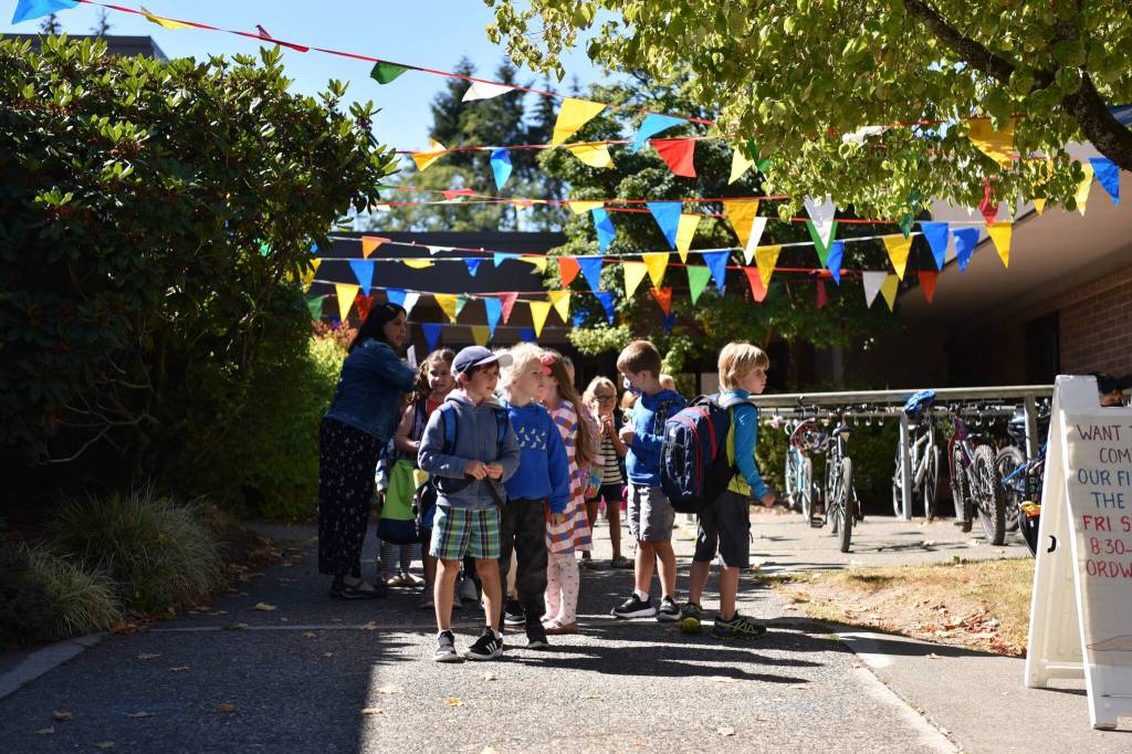 Ordway Elementary students look for their parents as they leave the building after their first day of school.
