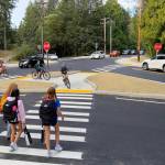 Students walk and cycle through the updated intersection at New Brooklyn and Sportsman Club roads on the morning of the first day of school Sept. 7. Nancy Treder/Bainbridge Island Review Photos