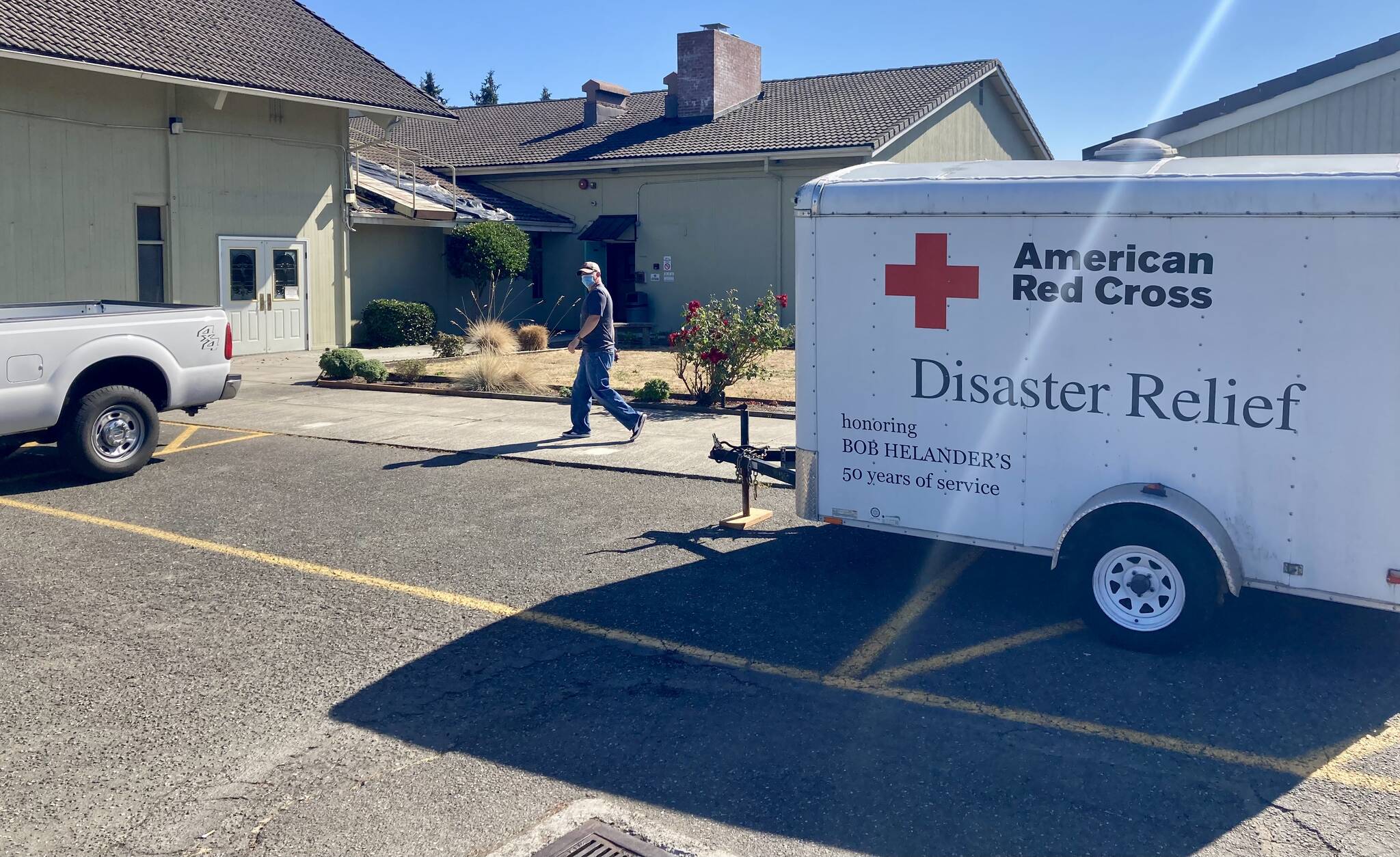 Red Cross vehicles and trailers sit outside the Silverdale United Methodist Church, which was activated as an emergency shelter for the fire victims. Elisha Meyer/Port Orchard Independent