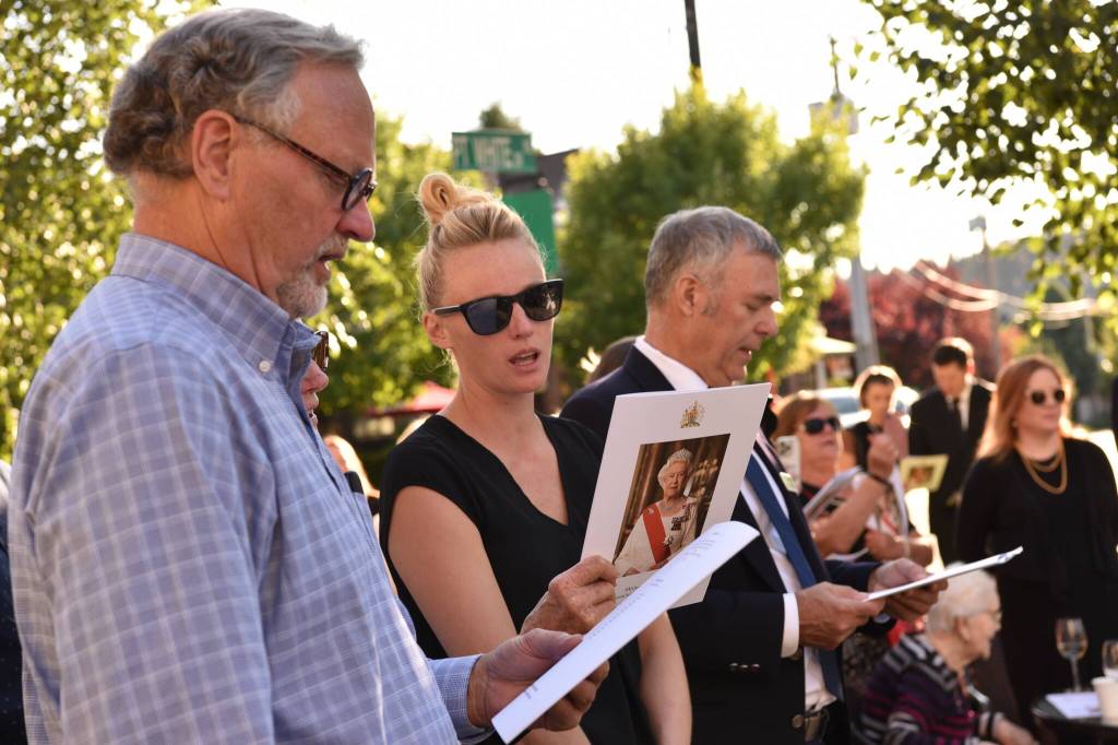 Guests sing the British National Anthem during the service.