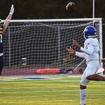Olympics Justin Kelley avoids Spartans Logan Sweeney before throwing the ball downfield to a receiver.
