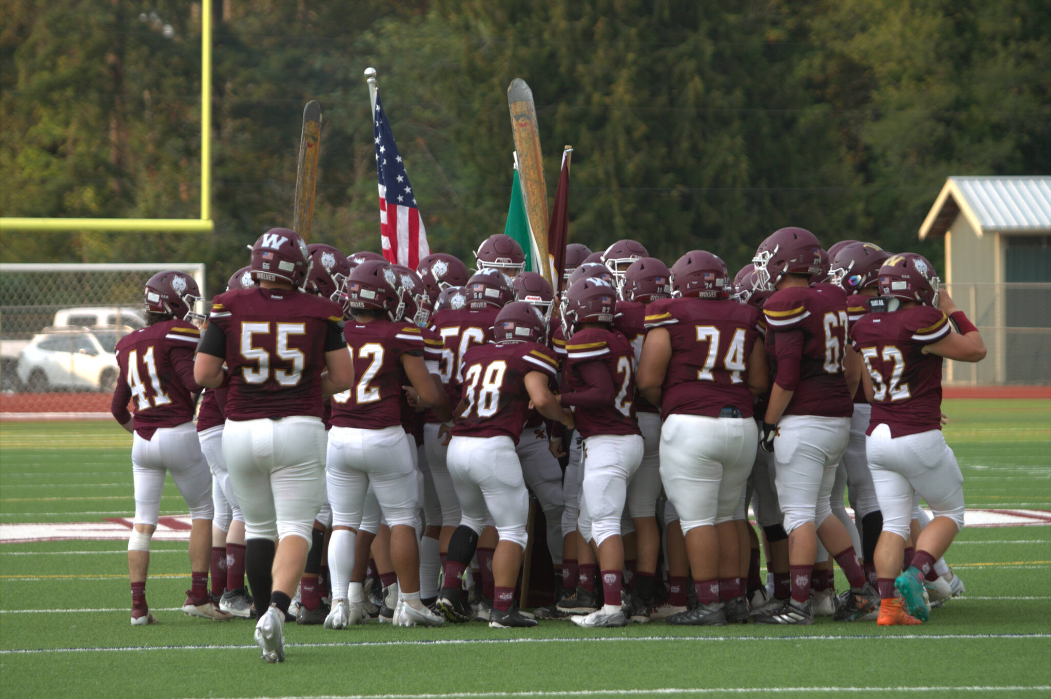 The Wolves meet by midfield after running through the pregame tunnel.