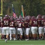 The Wolves meet by midfield after running through the pregame tunnel.