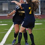Gabby Weis celebrates with Savannah Mabee after scoring the first of four goals in the game. Nicholas Zeller-Singh/Bainbridge Island Review Photos