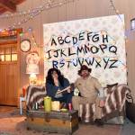 Maeve and Brent Haley, dressed as characters Joyce and Hopper from the TV series 'Stranger Things,' interact with kids on Halloween at their home in North Town Woods.