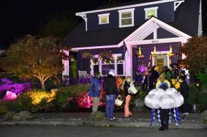 Kids line up for treats at a home in the popular North Town Woods neighborhood. Nancy Treder/Kitsap News Group Photos