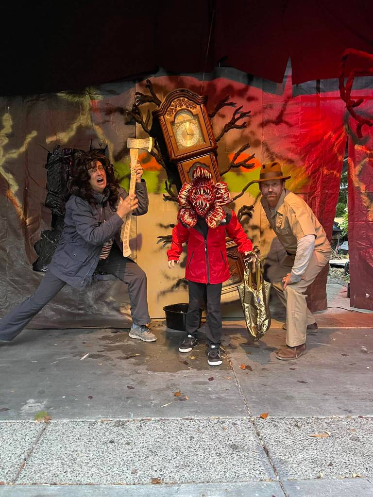 Maeve and Brent Haley pose with a demogorgon, 8-year-old Wylder Modine, in front of their 'Stranger Things' themed decorated house on Halloween. Hasalyn Modine Courtesy Photo