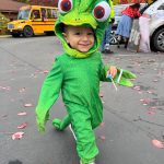 18-month-old Elijah Hernandez enjoys the Halloween event at St. Cecilia Catholic School.