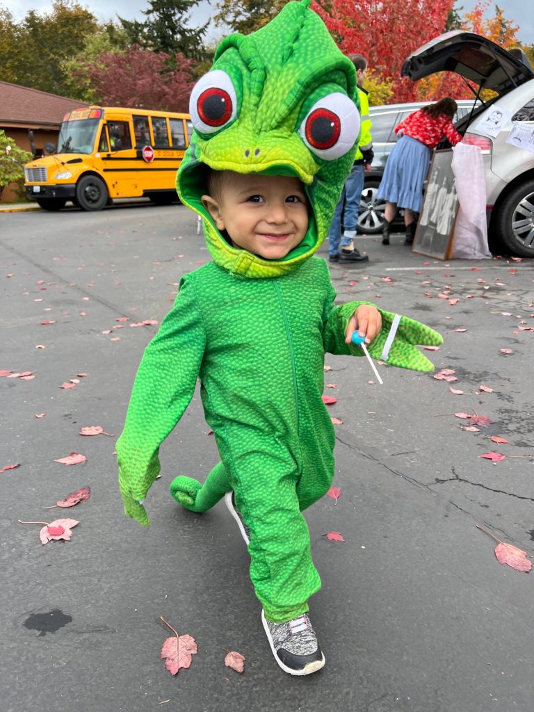 18-month-old Elijah Hernandez enjoys the Halloween event at St. Cecilia Catholic School.