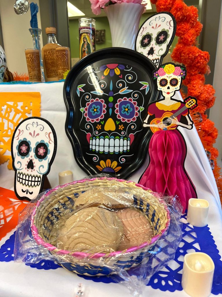 Conchas, Mexican sweet breads, are placed on the ofrenda, or altar, at St. Cecilia Catholic School to welcome the deceased for the Dia de los Muertos (Day of the Dead) celebration.