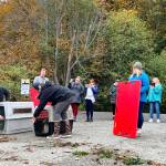 A dozen marine animal advocates attend the release of seal pups.