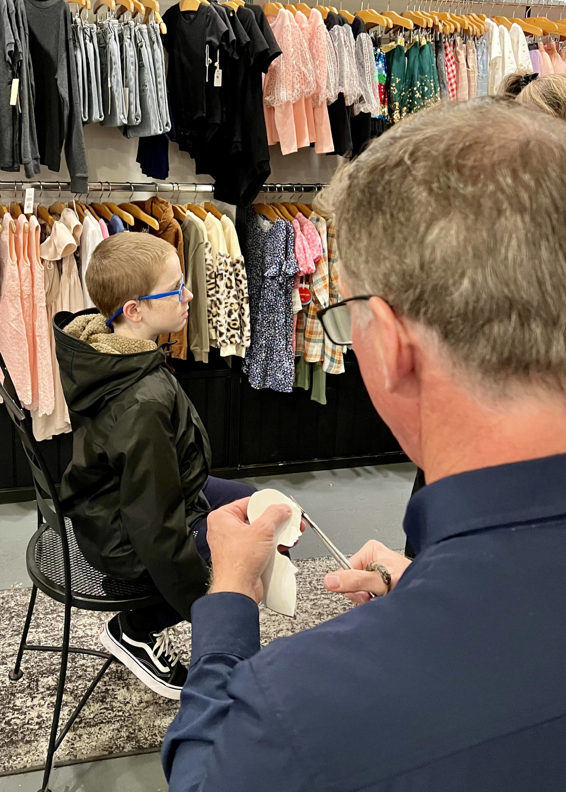 Riker Roth sits as his portrait is created by Karl Johnson.