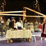 Mrs. Whatsit visits Meg Murry in her familys kitchen.