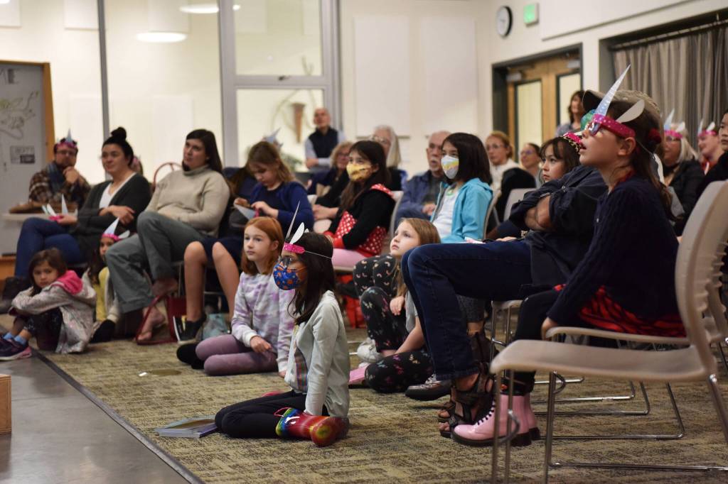 A room full of unicorn fans attend a book signing event with artist Dana Simpson, creator of the Phoebe and her Unicorn book series, at the BARN.