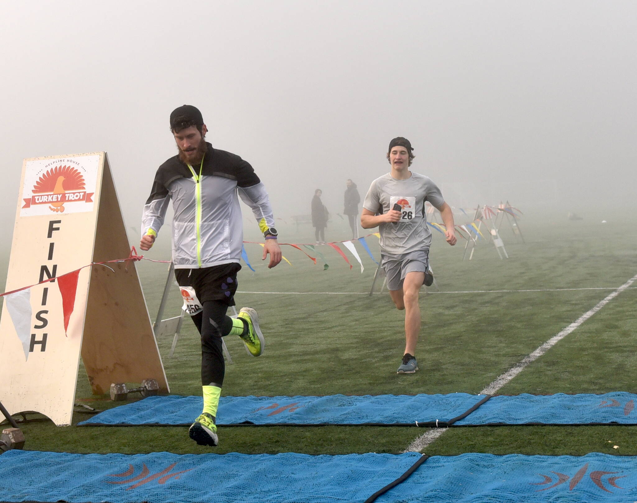 Ultramarathoner Greg Nance was the first to cross the finish line for the 3K run closely followed by Bainbridge High School sophomore Ben Fleming.
