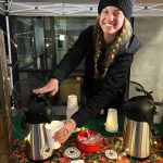 Lauren Petush pumps samples of Sassy Squatch Coffee for visitors.