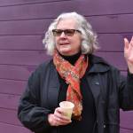 Heather Berger, executive director for Friends of the Farms, speaks with visitors during the Tiny Homes open house Dec. 10 at the Morales Farm.