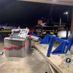 The mangled ATM lies on its side after being pulled from the ground. Courtesy Photos