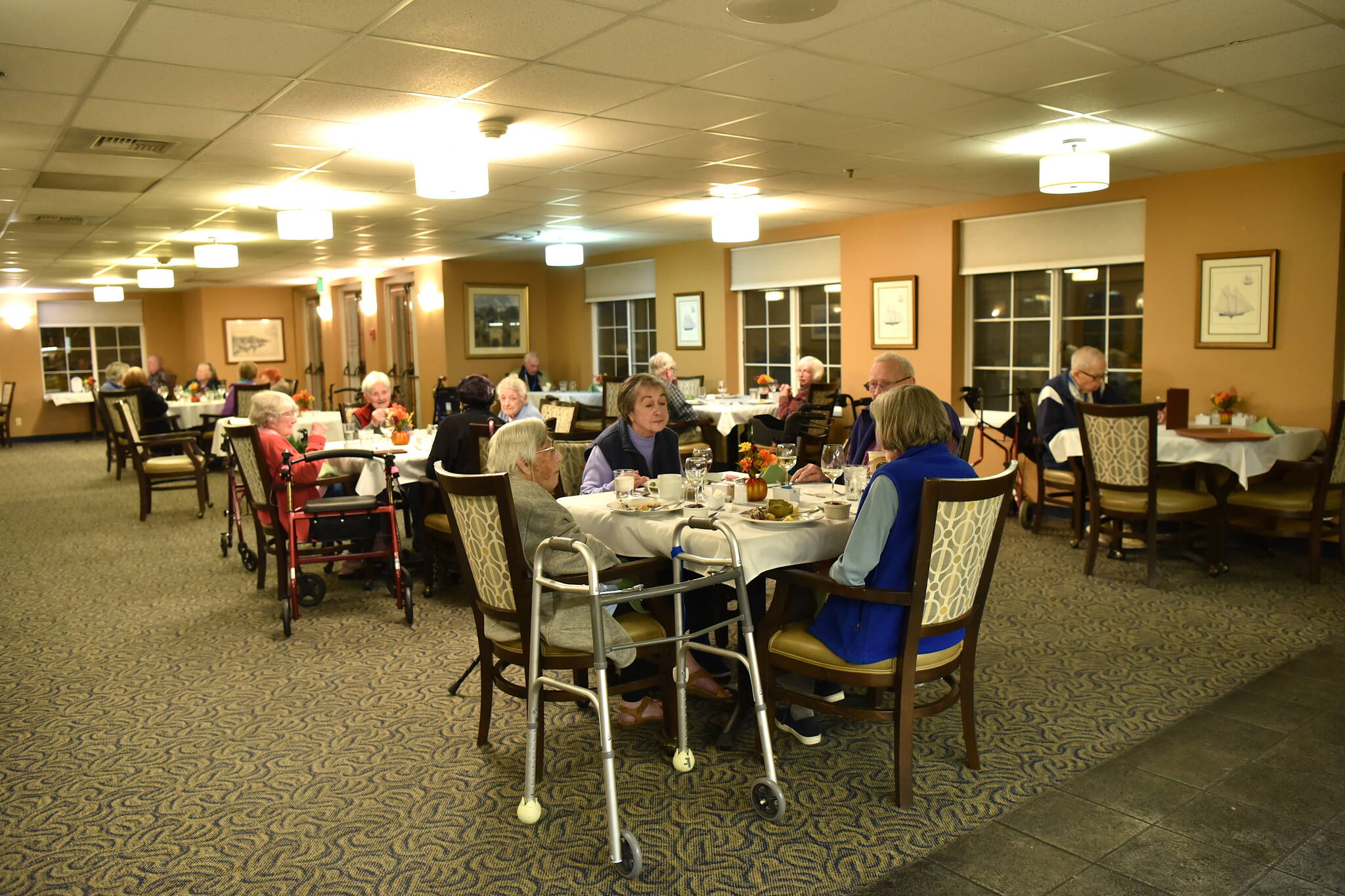 Residents living at Madison House enjoy interacting with the high school students who serve meals and chat with them in the dining room during meal times.