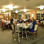 Residents living at Madison House enjoy interacting with the high school students who serve meals and chat with them in the dining room during meal times.