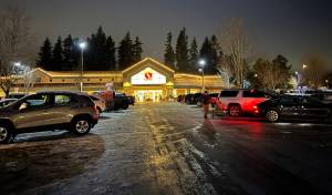 Cars filled the ice-covered parking lot at the Safeway grocery store on High School Road in anticipation of the ice storm Dec. 23. Nancy Treder/Kitsap News Group Photos