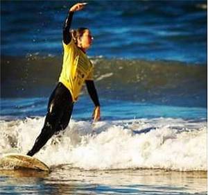 Sarah Dean of Bainbridge has been an avid surfer before and after her accident and amputation. Photos courtesy of Sarah Dean