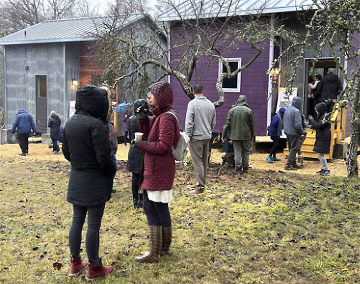 Materials from the partial demolition of the former Harrison Medical Center were used to build tiny houses for farm interns.