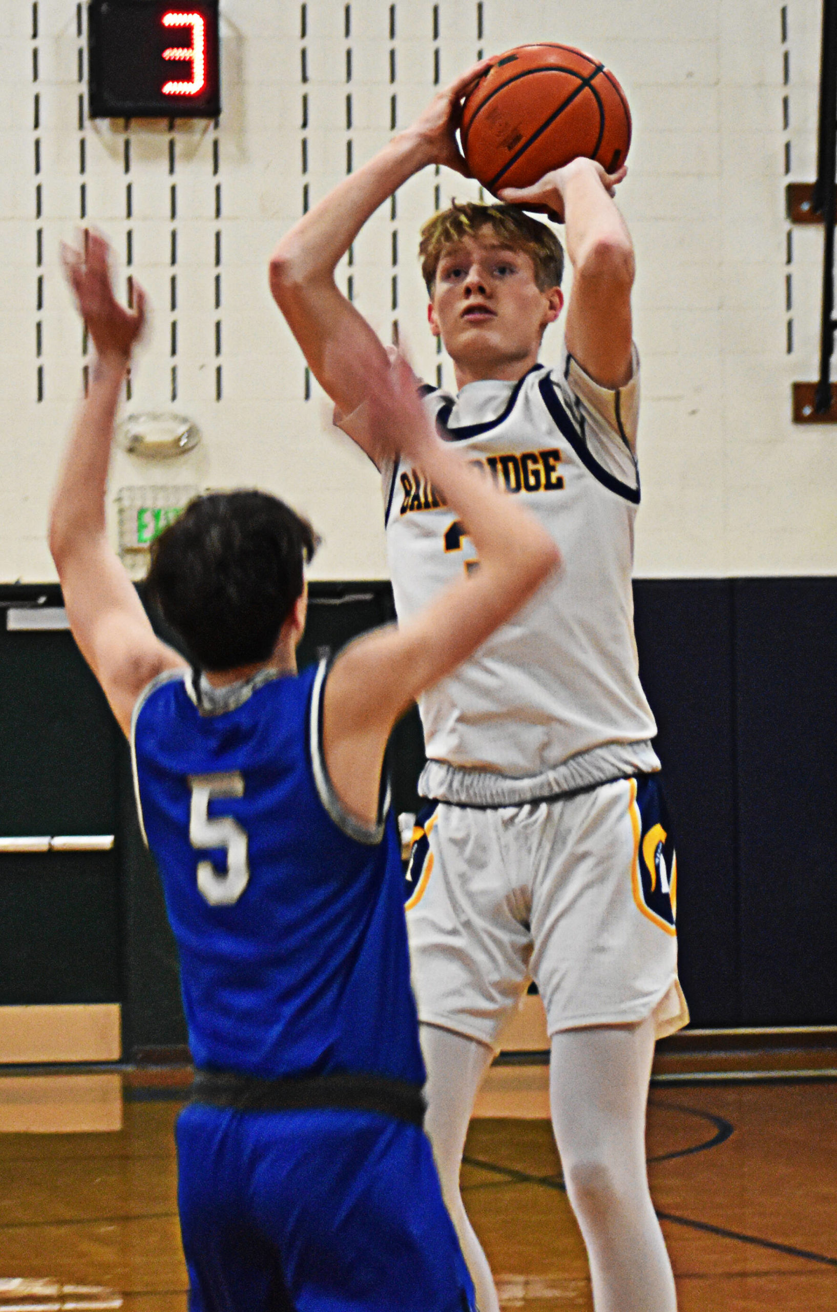 Sam Nylund shoots over a North Mason defender.