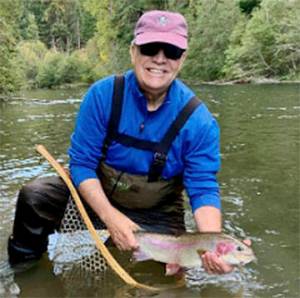 Jeff Renner with a large trout he caught in a Cascade stream. Courtesy Photo