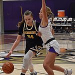 Bella Ramirez of the Spartans drives to the basket with NKs Evelyn Beers guarding closely. Nicholas Zeller-Singh/Kitsap News Group Photos