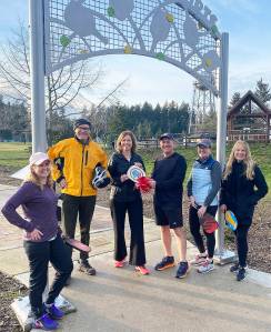 Anniken Krutnes, center, the first woman named Norway’s Ambassador to the United States, receives a replica of the first Pickleball paddle from Sean Megy, director of the Bainbridge Island Founders’ Tournament, Sunday on Bainbridge Island, the birthplace of the sport. Left to right are: Erin Prince, superintendent of Central Kitsap Schools; Gov. Jay Inslee; Krutnes; Megy; Lise Kristiansen, Norwegian Honorary Consul for Alaska; and Jacqueline Miller, Belgian Honorary Consul for Washington. The dignitaries were on BI for the announcement of the 2023 tournament to be held Aug. 9-13 at Battle Point Park. Tom Kelly Courtesy Photo