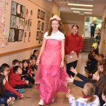 Seventh-grader Megan Zahumensky models a dress made from recycled materials during the Trashion Show where fifth- through eighth-graders showed off their eco-friendly fashion design skills.