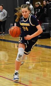 Bella Ramirez drives to the hoop to slim the lead against Silas. Nicholas Zeller-Singh/Kitsap News Group Photos