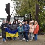 The group poses for a photo with tour guide and exclusion survivor Lilly Kitamoto Kodama.