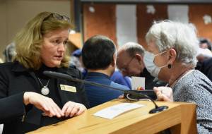 State Sen. Christine Rolfes speaks with a constituent after the Town Hall meeting. Nancy Treder/Kitsap News Group photos