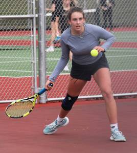 Bainbridges Cece Combs looks to return the ball to her opponent. Nicholas Zeller-Singh/Kitsap News Group Photos