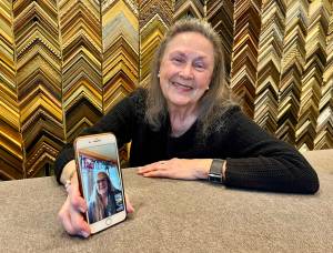 Julie Ulrich chats with her longtime friend, Leigh Ann Giles at her frame gallery in Fletcher Bay which she started 30 years ago. Nancy Treder/Kitsap News Group Photos
