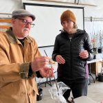 Nancy Treder/Kitsap News Group Photos
Fruit Club member Dennis Faust shows Mailey Martinez a grafting technique.