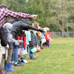 Parents give last-minute advice to their children before they take to the field to gather eggs.