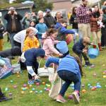 Kids wildly scramble for eggs during the Easter Egg Dash at Woodland Middle School April 8.