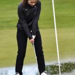 North Kitsaps Calia Corden putts through a puddle to finished the second hole. Nicholas Zeller-Singh/Kitsap News Group Photos