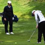 Bainbridges Elise Walters puts some power on her putt to make sure it can get through the wet green.