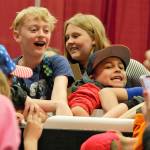 A group of students tries to remain chill while dipping their hands in a cooler of ice water. Elisha Meyer/Kitsap News Group Photos