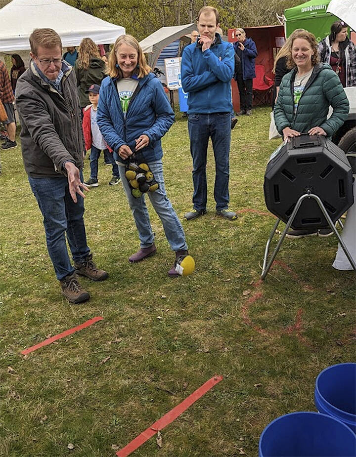 U.S. Rep. Derek Kilmer plays a game at one of the booths. Mike Kelly courtesy photo