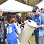 Erika Dorsey and daughter Quinlynn learn about a Meade telescope from Battle Point Astronomical Association volunteer Joe Mulligan.