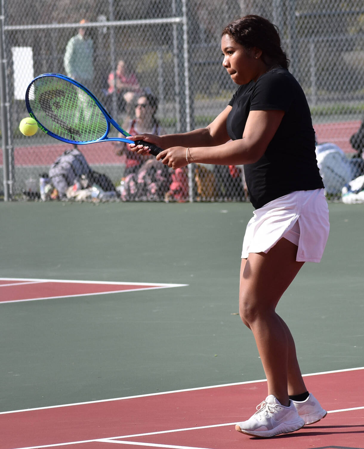 Odessa Fejeran smashes the ball past the Spartans.