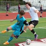 Michael Divano fights for possession near the Steel United FC goal.