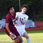 Telmo Buxens-Astorqui battles for the ball with Steilacooms defender.