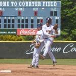 Eddie Bignold, with shortstop McCrea Curfman behind him, makes a tough play up the middle but Liberty ended up with an infield single.